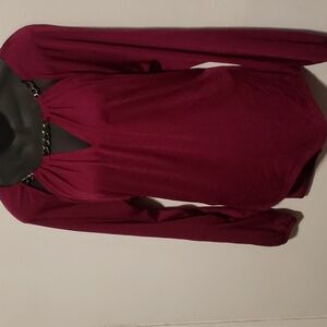 Jennifer Lopez, ladies, purple blouse.  Very Very Nice.